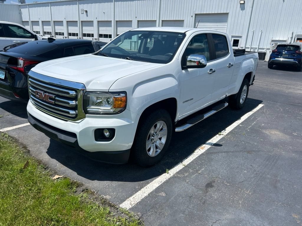 2017 GMC Canyon 4WD SLE in Summit White — front three-quarter view