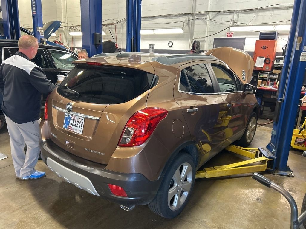 2016 Buick Encore Convenience in Includes (Bqu) Dark Cocoa Ash Lower Accent Color.) — front three-quarter view