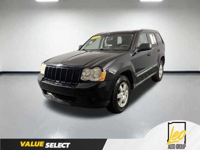 2008 Jeep Grand Cherokee Laredo in Black Clearcoat — front three-quarter view